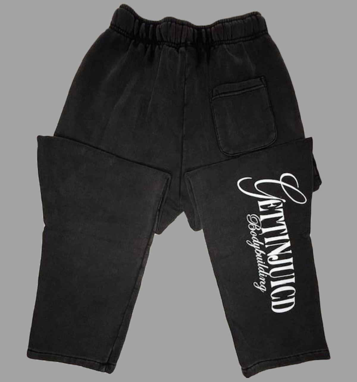 Rear view of black GettinJuicd men’s jogging bottoms for gym featuring back pocket and bold leg branding — perfect workout joggers for men.