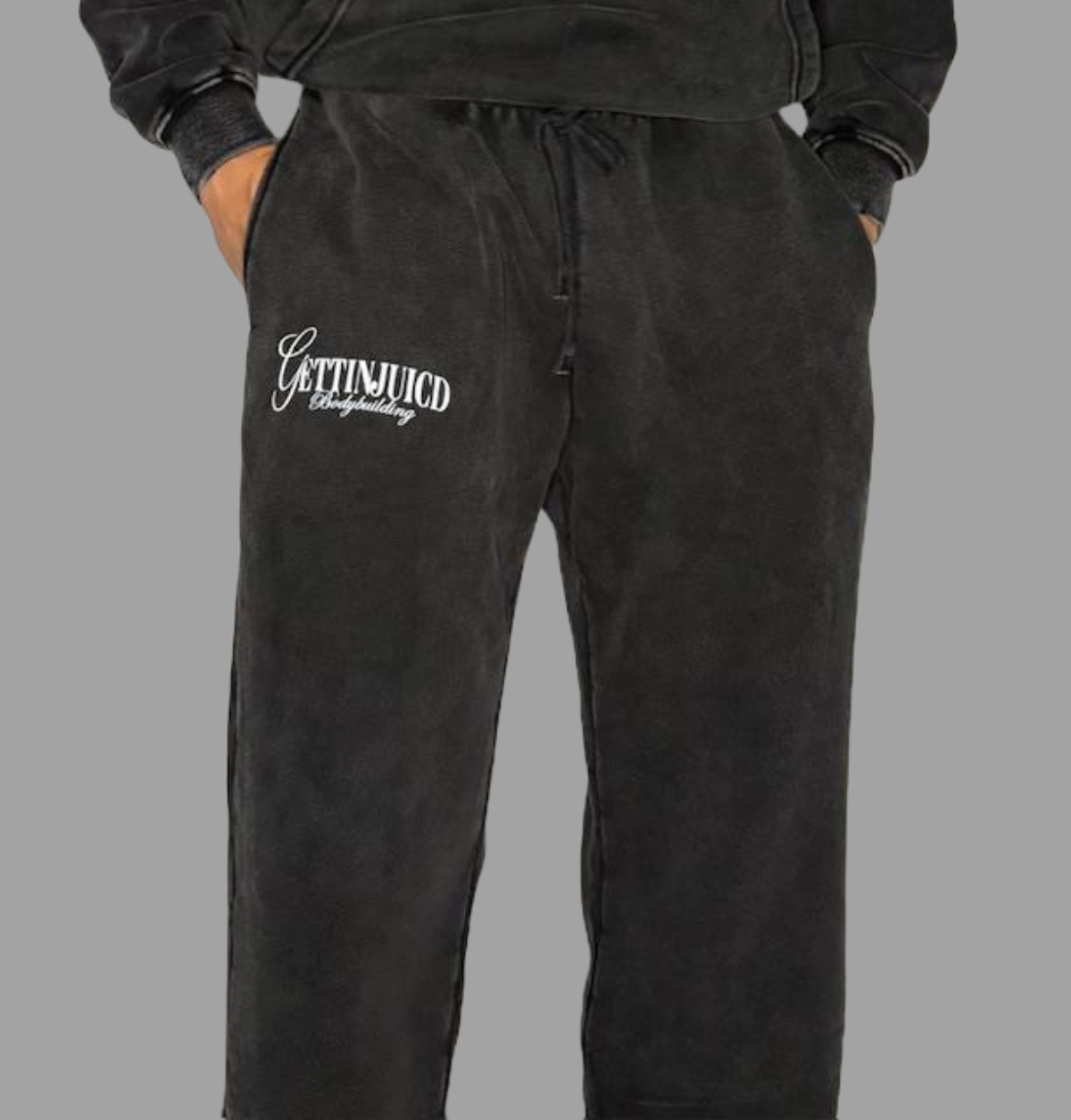Model wearing black tapered gym joggers by GettinJuicd — stylish and functional men’s jogging bottoms for gym and lifestyle wear