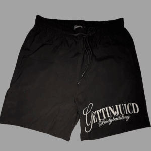 Flat lay of black GettinJuicd men’s gym shorts with drawstring waistband and bodybuilding logo.