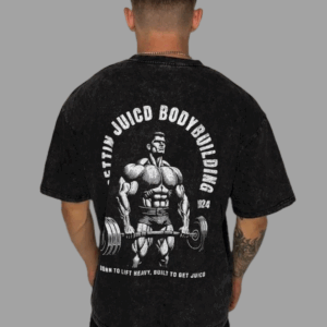 Model wearing Juicd Up workout t-shirt for men with bold bodybuilding graphic and slogan: Born to Lift Heavy, Built to Get Juicd.